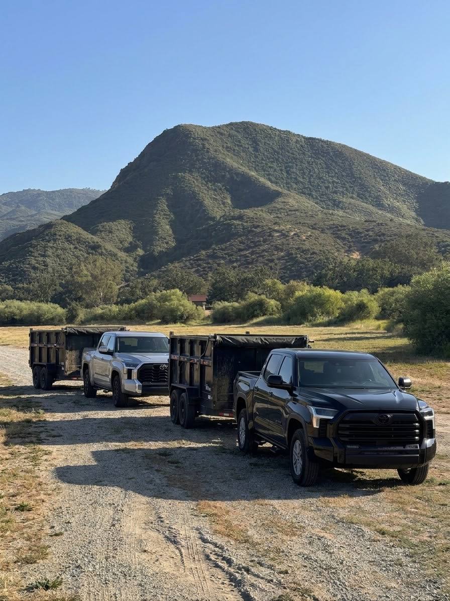 25/7 pickup trucks loaded and ready for a junk removal job at a Ventura County home